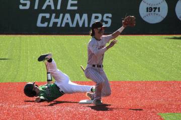 Jacob Powers/Pahrump Valley Times Trojans second baseman Tony Whitney tags a Virgin Valley runn ...